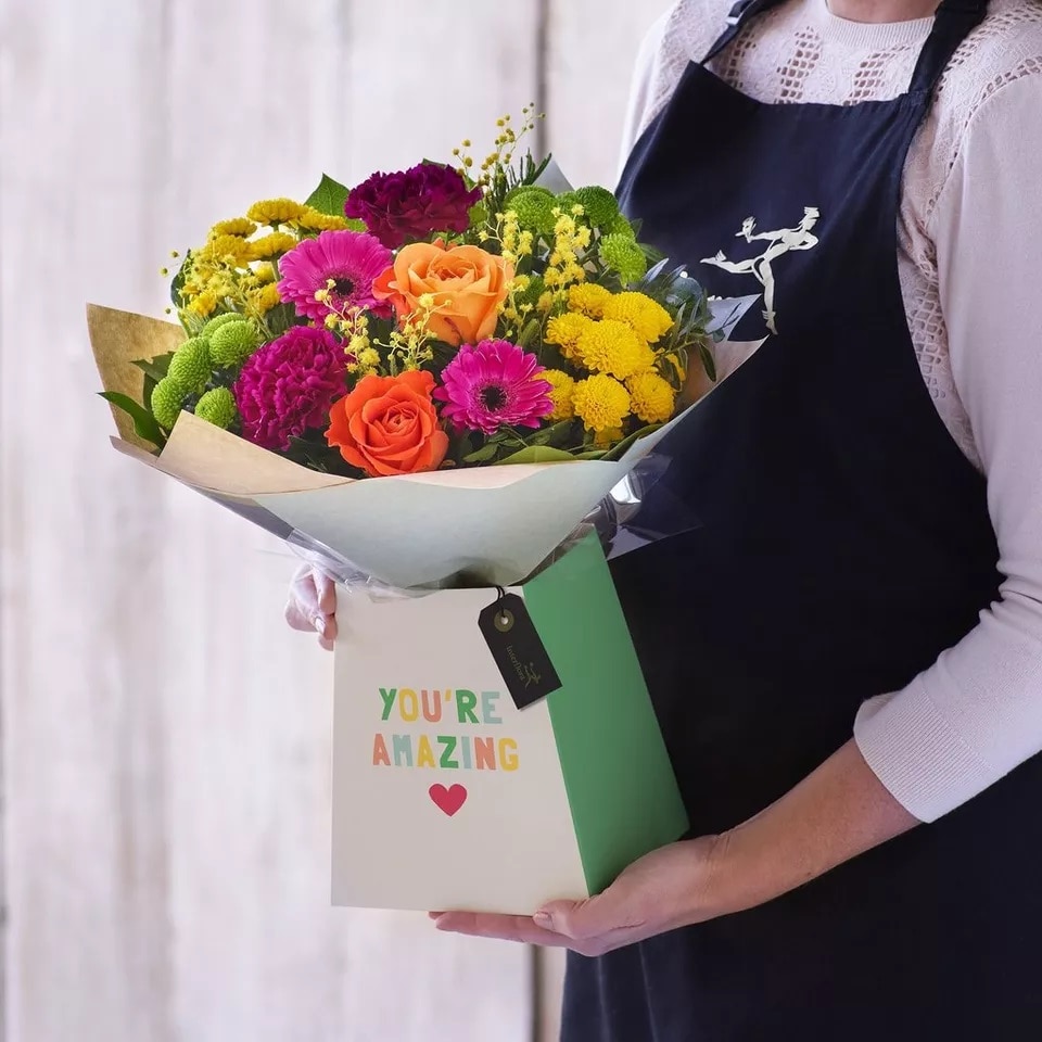 Bright Gift box made with the finest flowers size,  inches height and  inches wide.